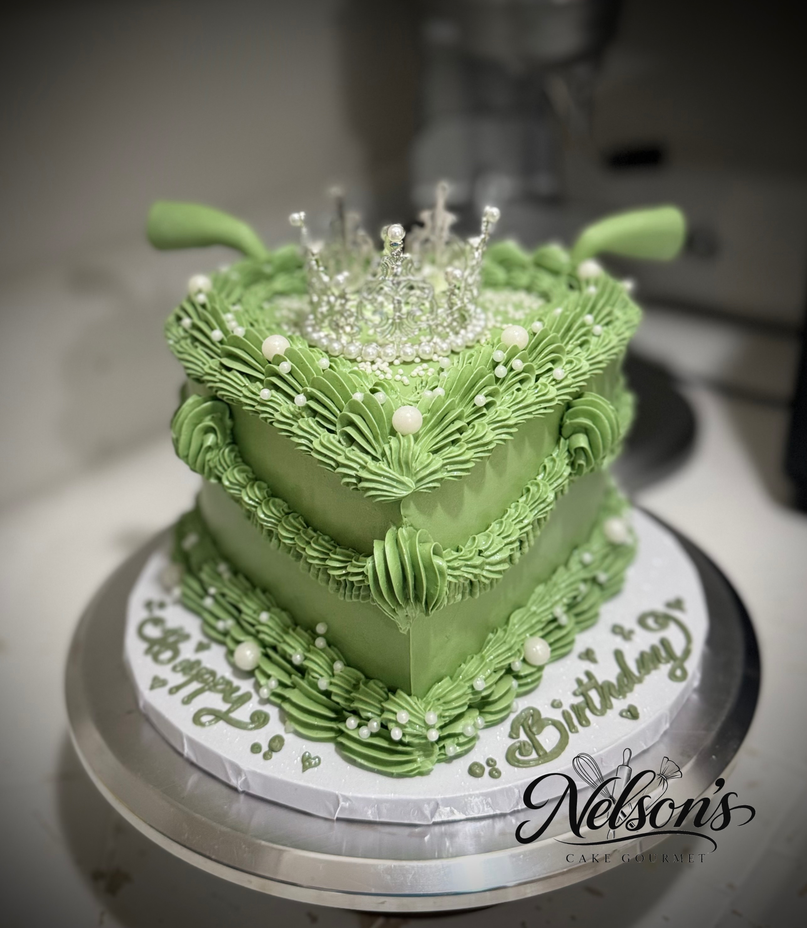 Green heart-shaped vintage piped birthday cake